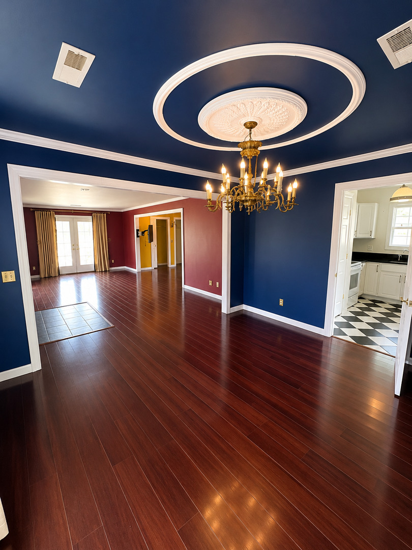 354 19th Place Clinton, IA 52732 - Photo 10 of 16 wooden floor in an empty room with a window