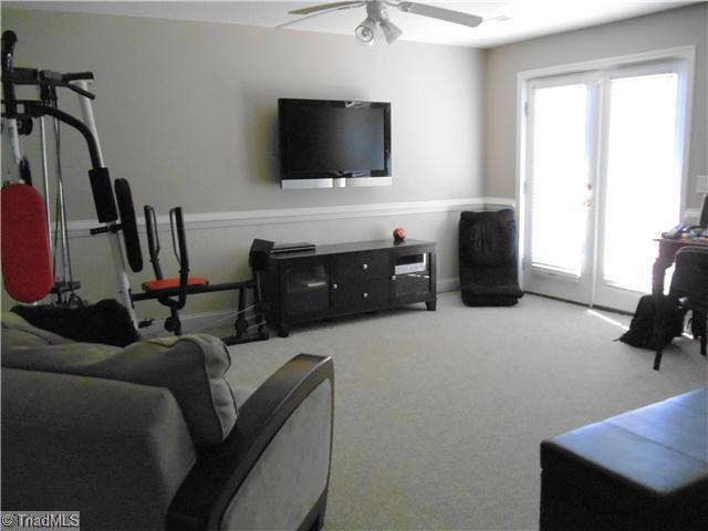 123 Hagen Road Advance, NC 27006 - Photo 11 of 16 Den/Family/Great Room. The double doors open to a patio area. Great "Man Cave".