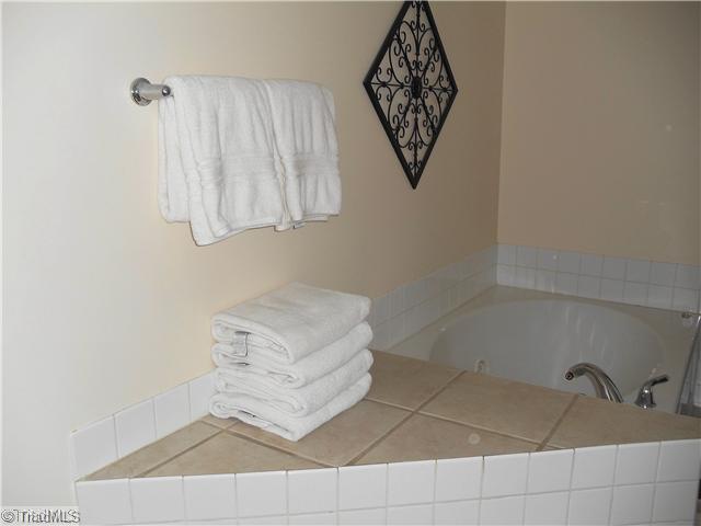 123 Hagen Road Advance, NC 27006 - Photo 15 of 16 Master Bath/Spa. The Master Bath has a "Spa Feel" with this ceramic tile jetted tub.