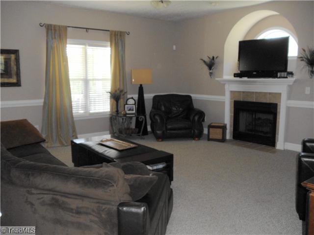 123 Hagen Road Advance, NC 27006 - Photo 3 of 16 Living Room. Notice the nice Gas Log fireplace.