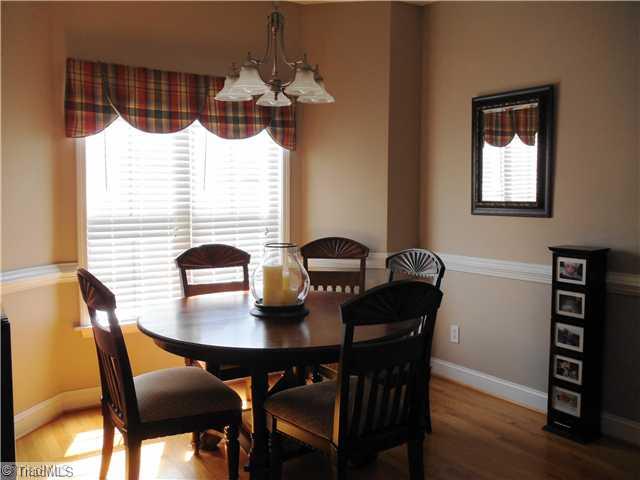 123 Hagen Road Advance, NC 27006 - Photo 8 of 16 Dining Room. Dining room features beautiful hard wood floors and chair railing.