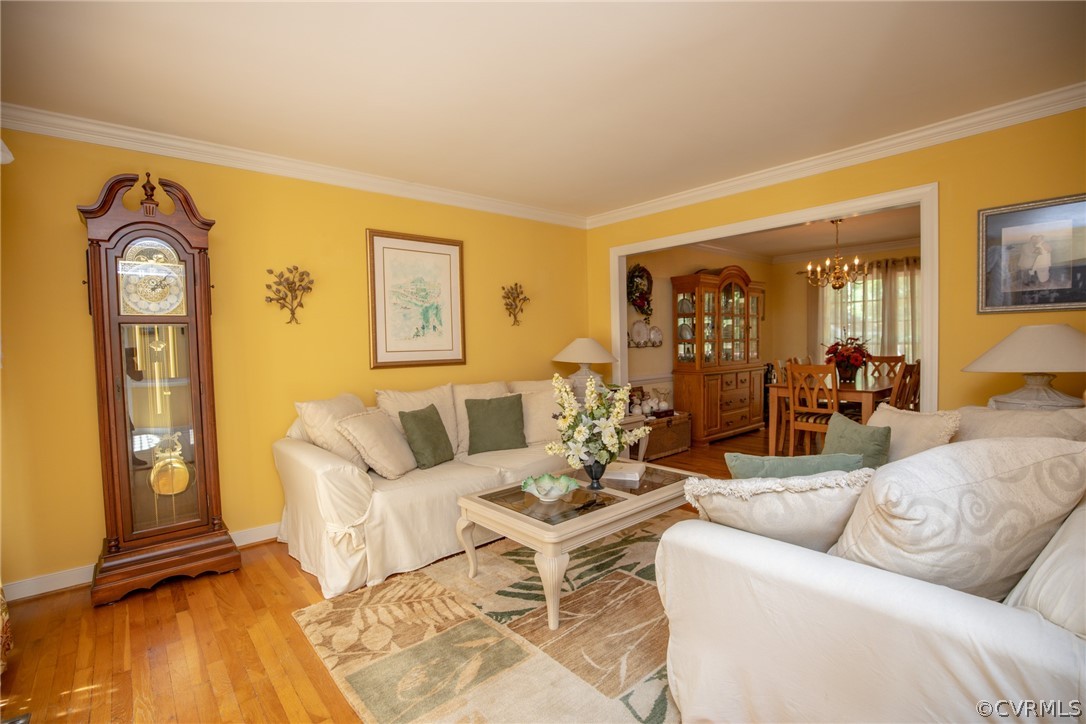 13340 Carters Way Road Chesterfield, VA 23838 - Photo 3 of 44 a living room with furniture a wooden floor and large windows