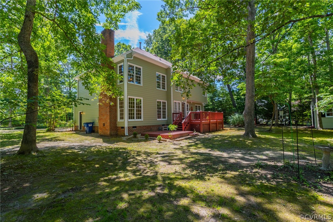 13340 Carters Way Road Chesterfield, VA 23838 - Photo 33 of 44 a backyard of a house with table and chairs plants and large trees