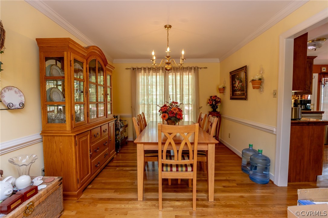 13340 Carters Way Road Chesterfield, VA 23838 - Photo 5 of 44 a view of a dining room with furniture window and wooden floor