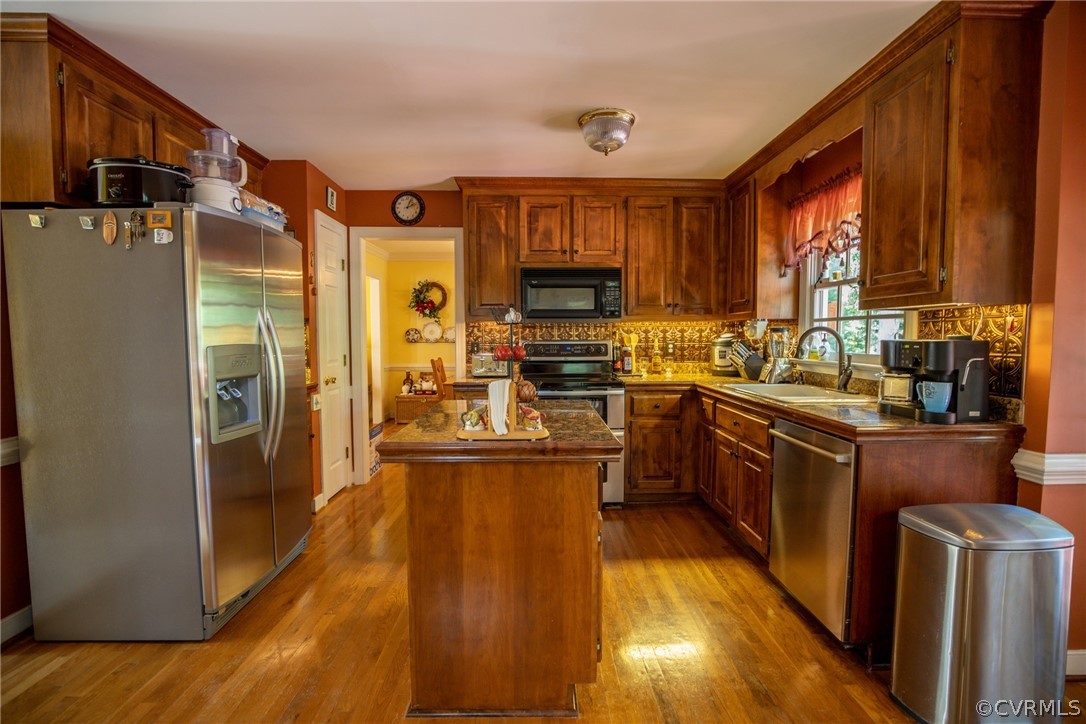 13340 Carters Way Road Chesterfield, VA 23838 - Photo 7 of 44 a kitchen with stainless steel appliances granite countertop a refrigerator a stove top oven a sink and dishwasher