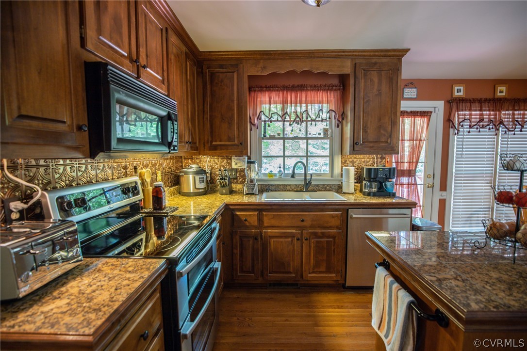 13340 Carters Way Road Chesterfield, VA 23838 - Photo 8 of 44 a kitchen with a sink stove top oven and cabinets