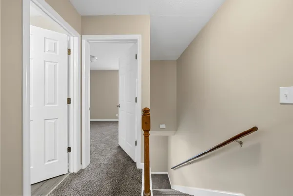 a view of a hallway with rooms