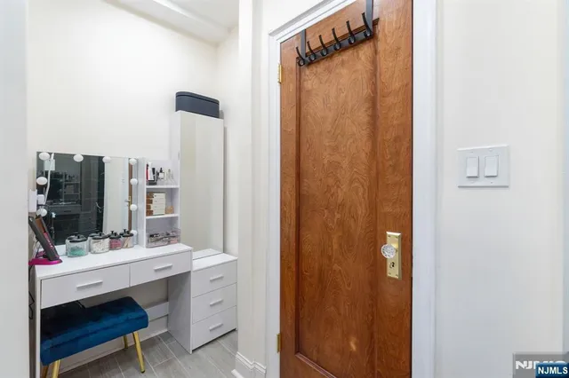 a bathroom with a sink vanity and a mirror