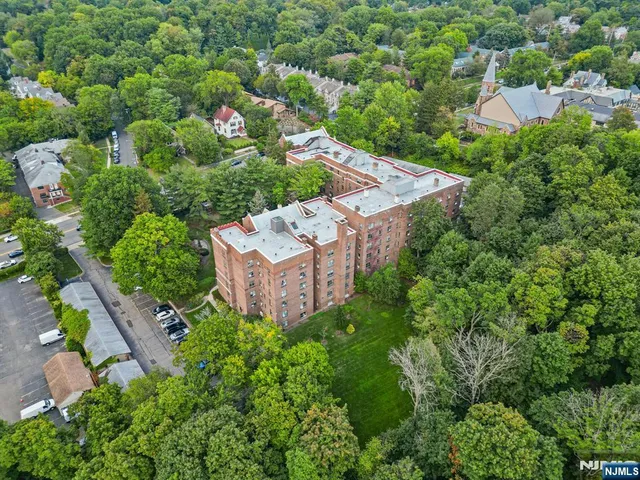 an aerial view of a house with a garden