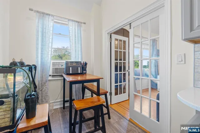 a view of a livingroom with furniture and a window