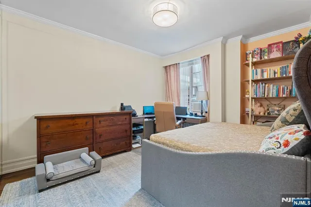 a bed room with a bed and a window