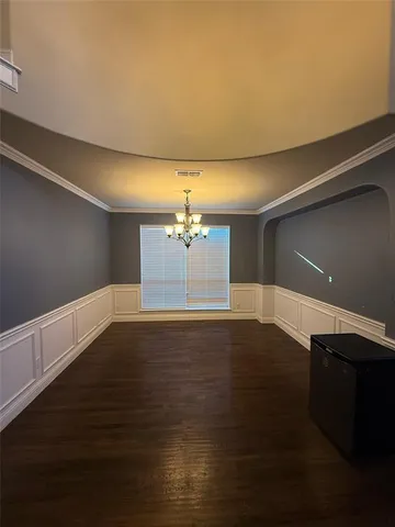 a view of a livingroom with a fireplace and a ceiling fan
