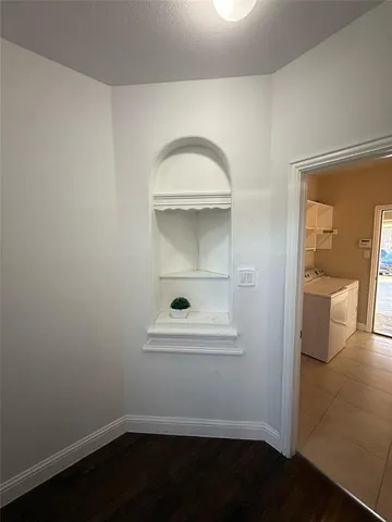 a view of a livingroom with wooden floor