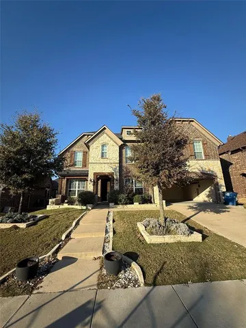 a view of a house with backyard patio and fire pit