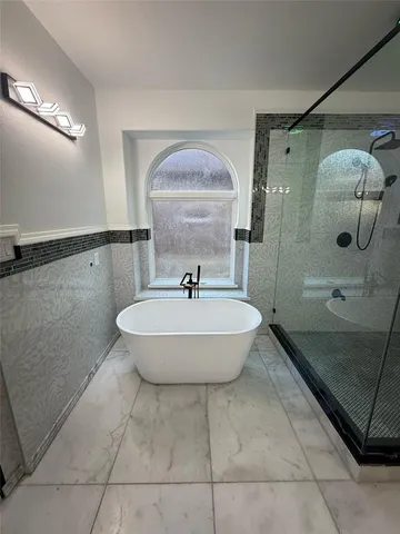 a bathroom with a sink and shower