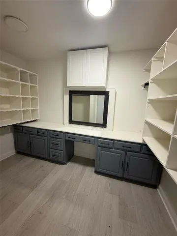 a living room with a bed furniture and a window