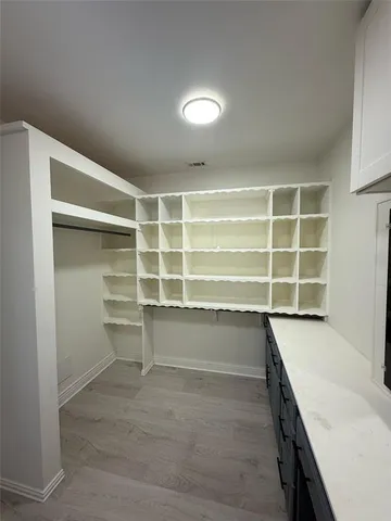 a view of an empty room with a empty shelves