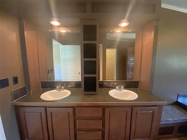 a bathroom with a toilet and a sink