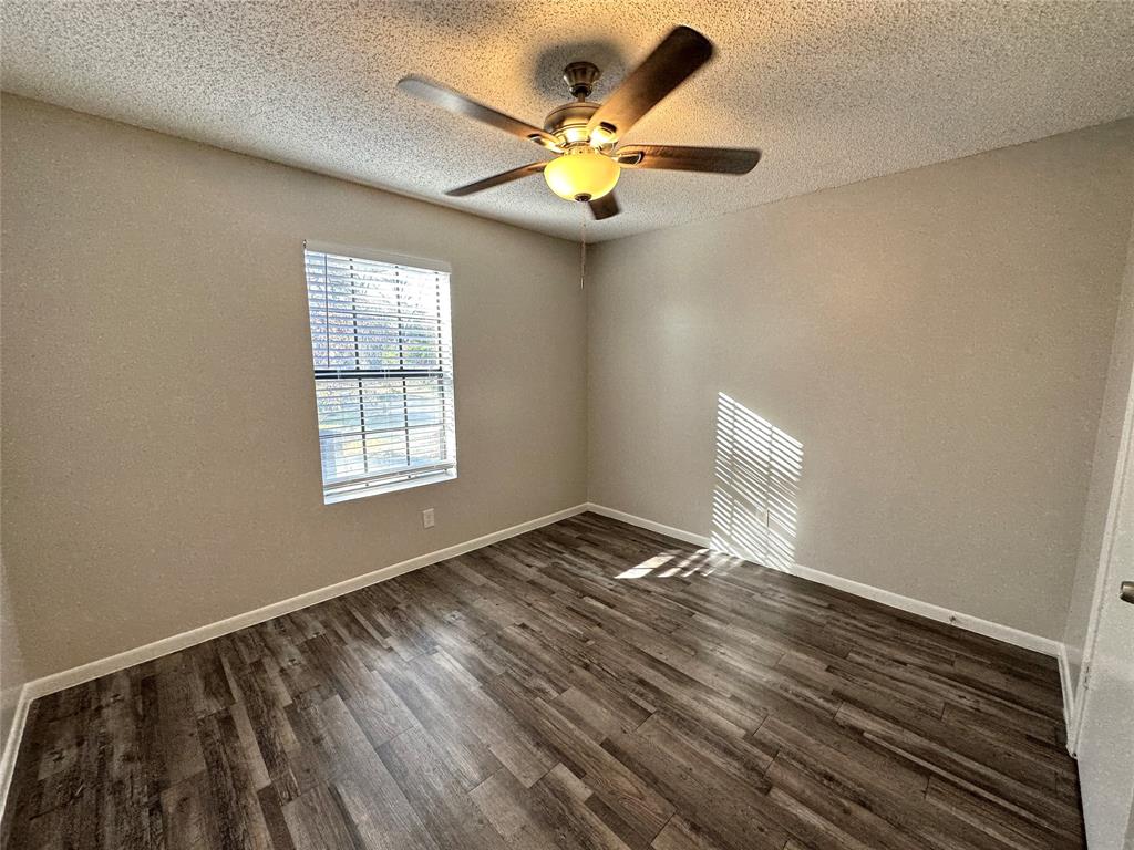 2006 Jane Street, Unit C Longview, TX 75601 - Photo 6 of 12 a view of an empty room with a window