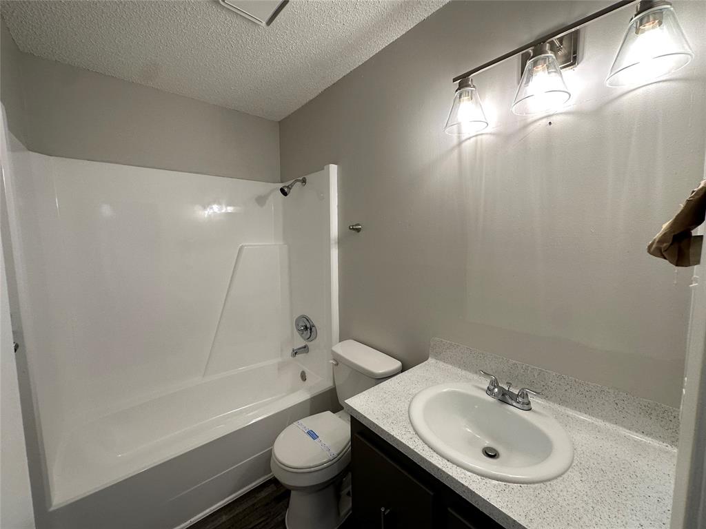 2006 Jane Street, Unit C Longview, TX 75601 - Photo 7 of 12 a bathroom with a sink toilet and shower