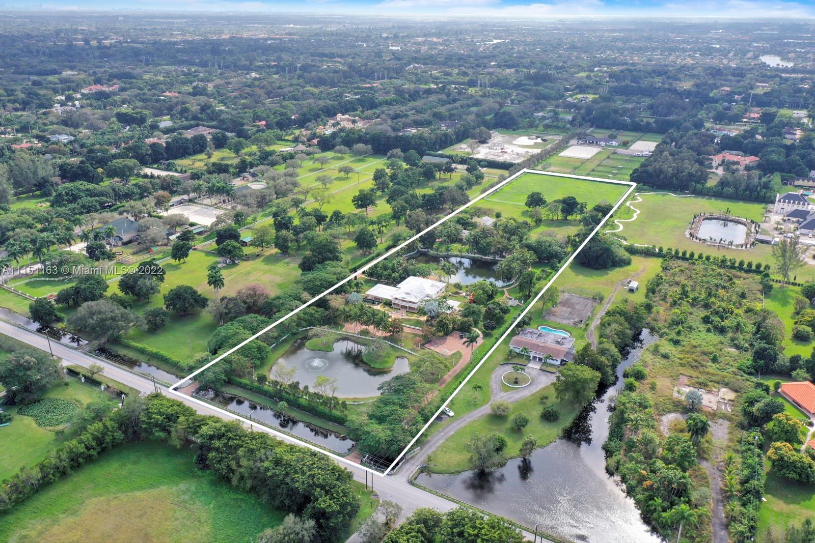 13920 Stirling Road Southwest Ranches, FL 33330 - Photo 1 of 98 an aerial view of a residential houses