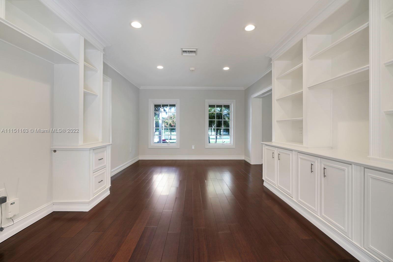 13920 Stirling Road Southwest Ranches, FL 33330 - Photo 16 of 98 a view of an empty room with wooden floor and a window