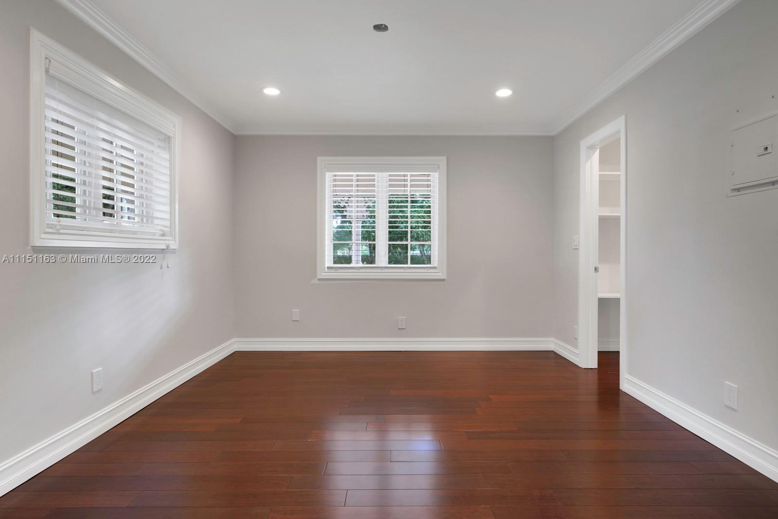 13920 Stirling Road Southwest Ranches, FL 33330 - Photo 20 of 98 a view of an empty room with wooden floor and a window