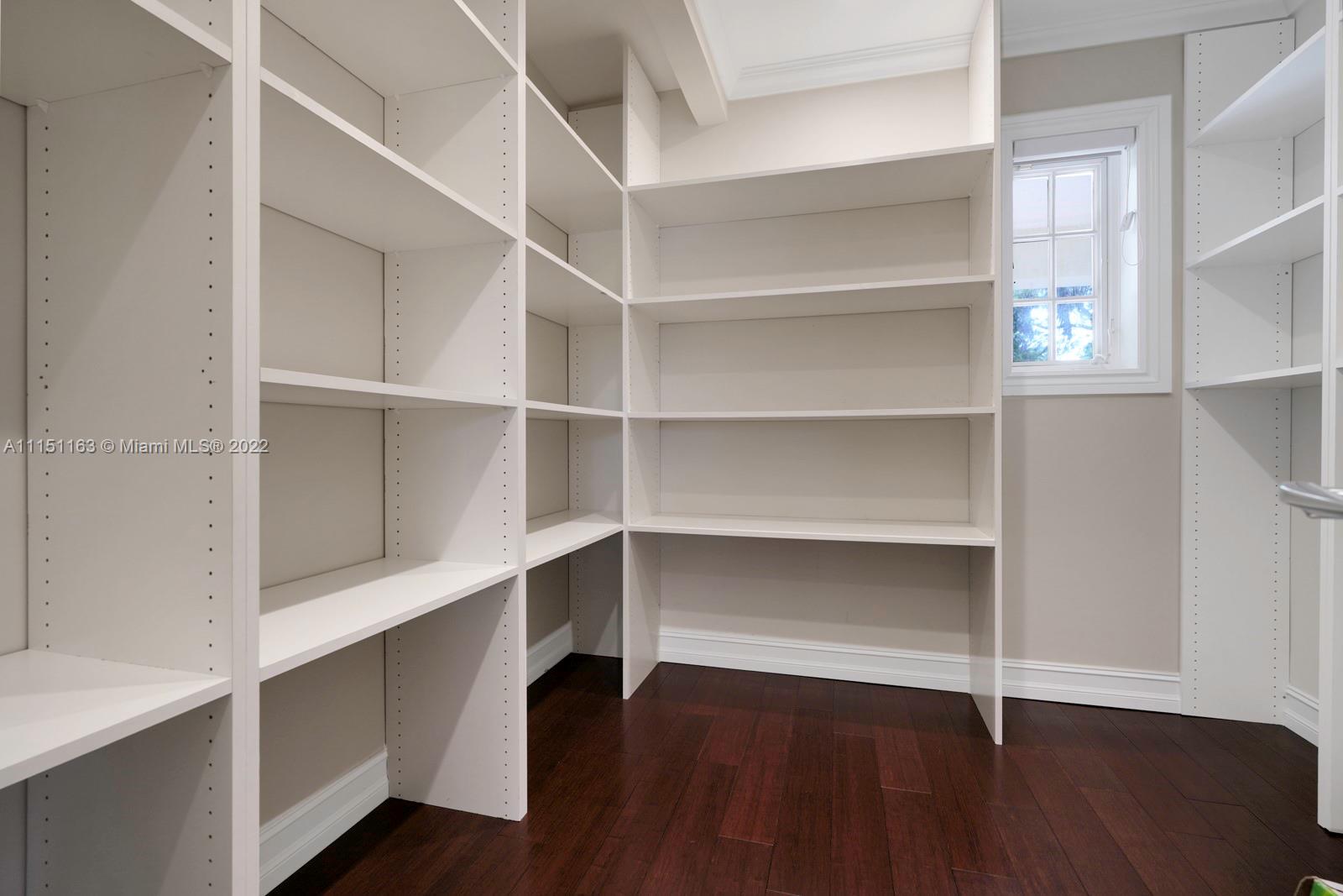 13920 Stirling Road Southwest Ranches, FL 33330 - Photo 21 of 98 a view of walk in closet with empty racks