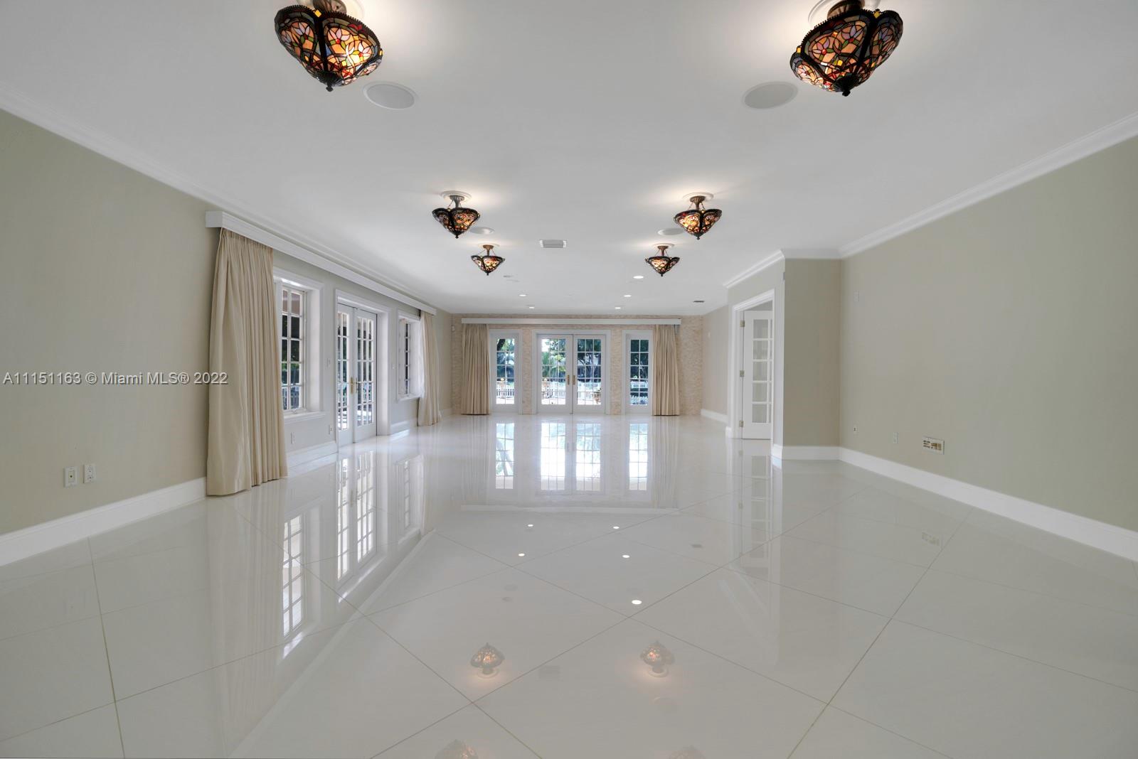 13920 Stirling Road Southwest Ranches, FL 33330 - Photo 23 of 98 wooden floor in an empty room with a window
