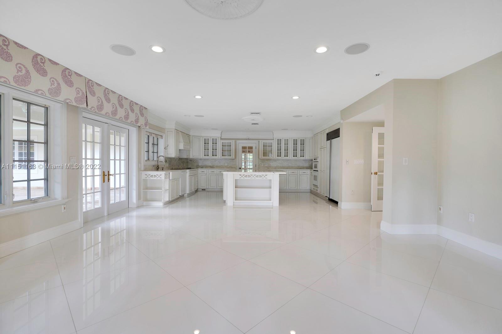13920 Stirling Road Southwest Ranches, FL 33330 - Photo 30 of 98 a view of a big room with windows and chandelier