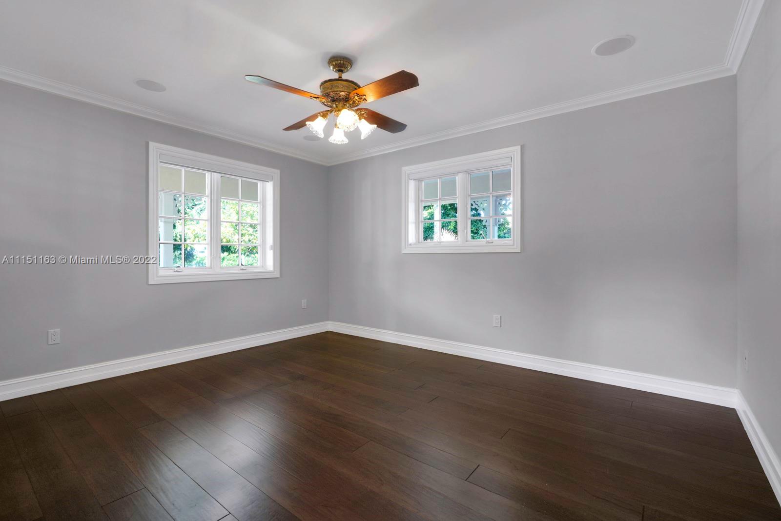 13920 Stirling Road Southwest Ranches, FL 33330 - Photo 38 of 98 a view of an empty room with wooden floor and a window