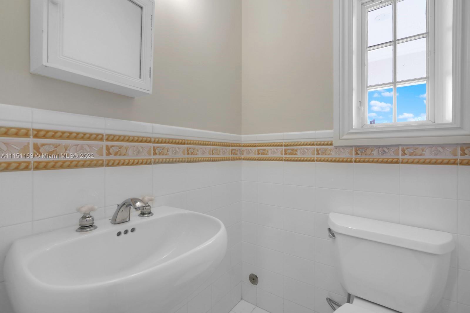 13920 Stirling Road Southwest Ranches, FL 33330 - Photo 41 of 98 a bathroom with a sink and a toilet