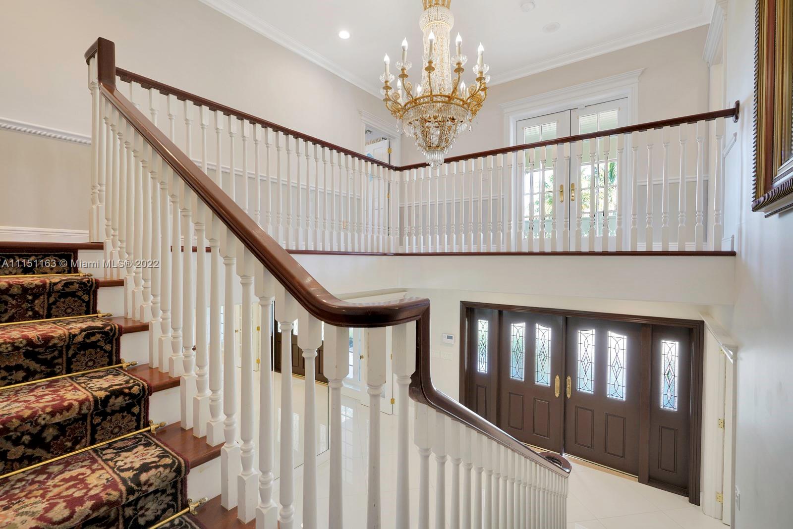 13920 Stirling Road Southwest Ranches, FL 33330 - Photo 43 of 98 a view of entryway and hall with wooden floor