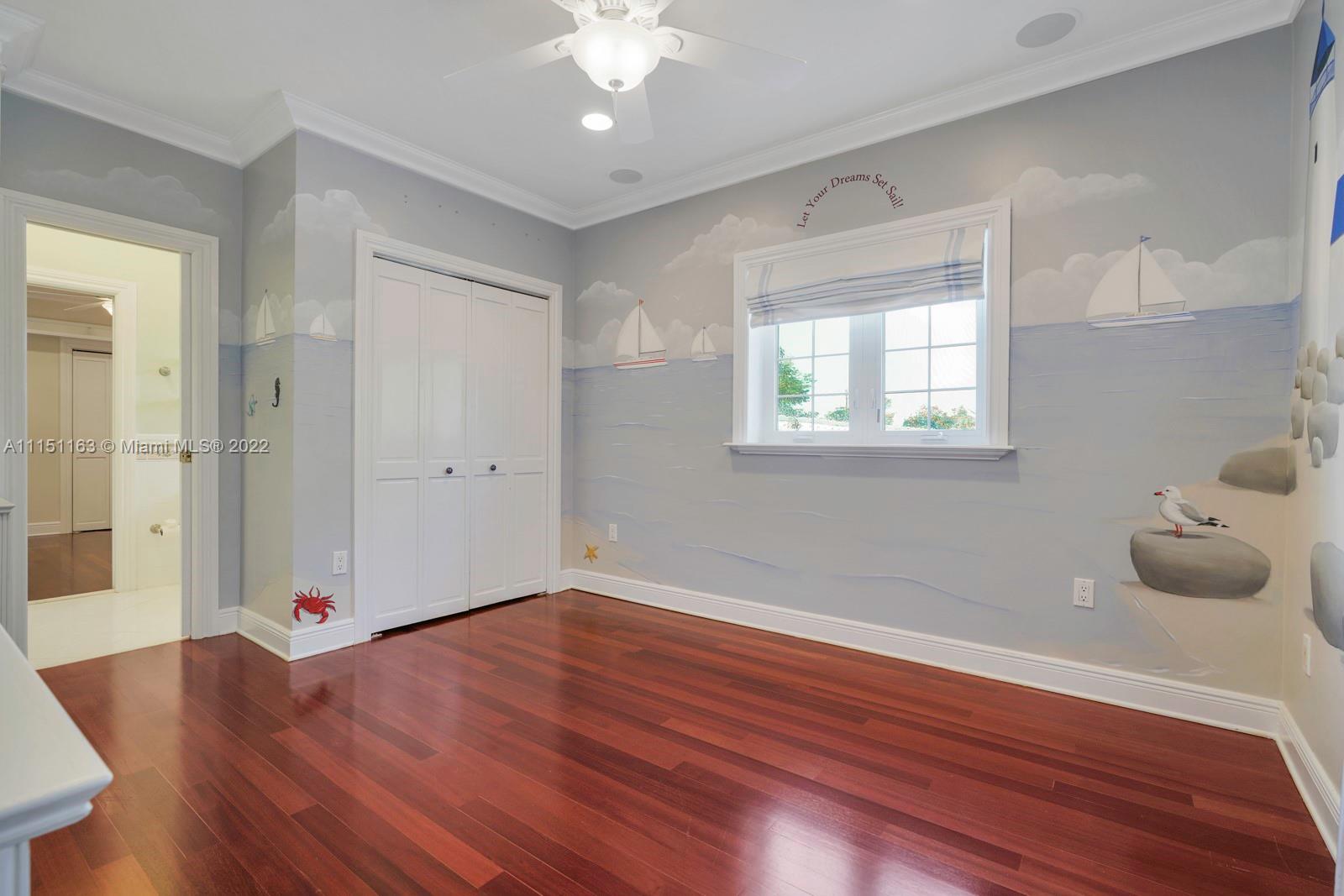 13920 Stirling Road Southwest Ranches, FL 33330 - Photo 44 of 98 a view of an empty room with wooden floor and a window