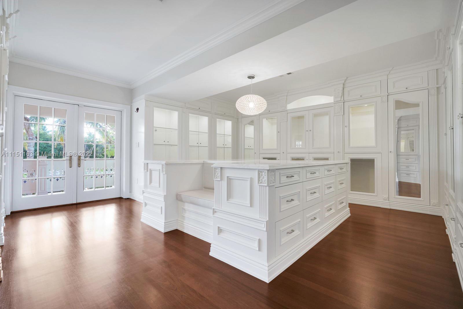 13920 Stirling Road Southwest Ranches, FL 33330 - Photo 50 of 98 a view of a bedroom with wooden floor and windows