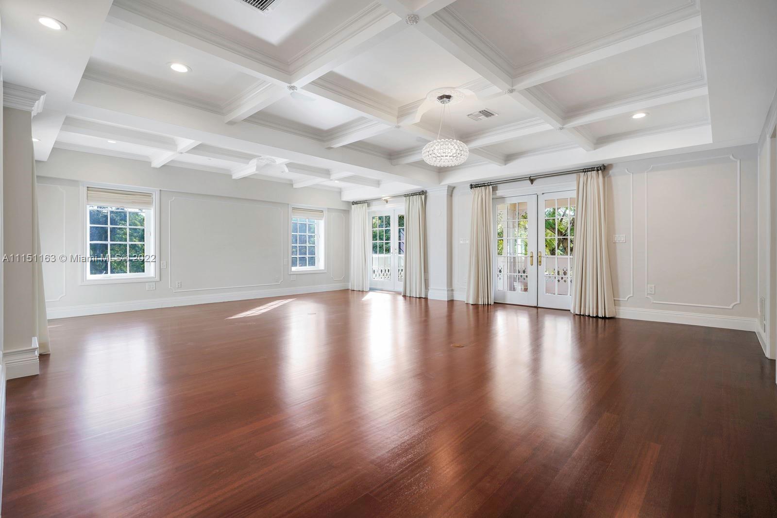 13920 Stirling Road Southwest Ranches, FL 33330 - Photo 59 of 98 an empty room with wooden floor and windows
