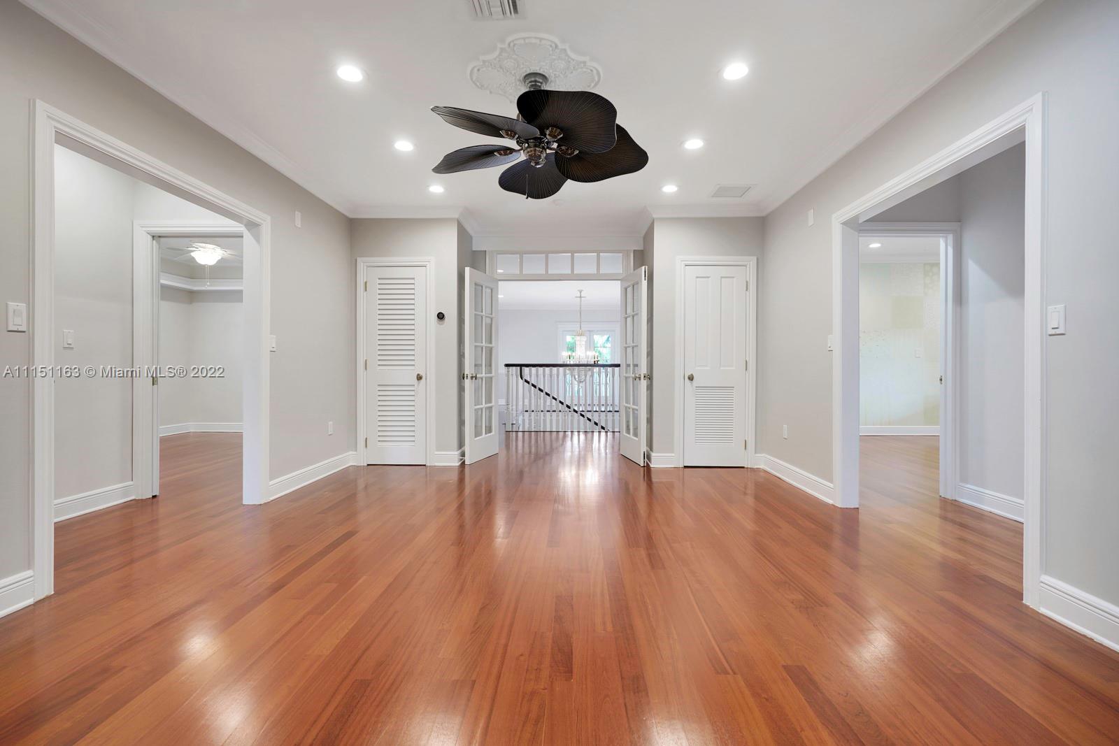 13920 Stirling Road Southwest Ranches, FL 33330 - Photo 62 of 98 a view of an empty room with wooden floor and a window
