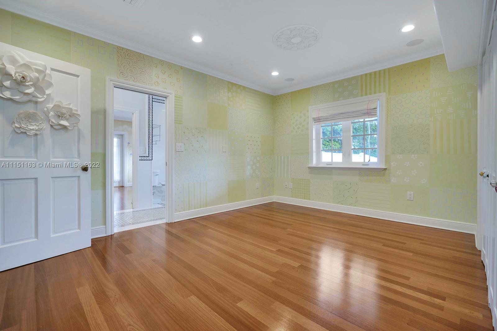 13920 Stirling Road Southwest Ranches, FL 33330 - Photo 63 of 98 a view of empty room with wooden floor and fan