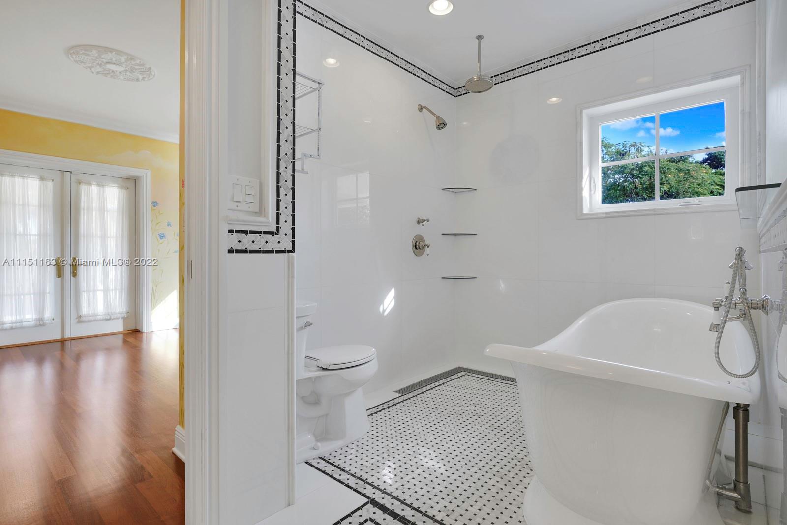 13920 Stirling Road Southwest Ranches, FL 33330 - Photo 65 of 98 a bathroom with a toilet a sink and a shower