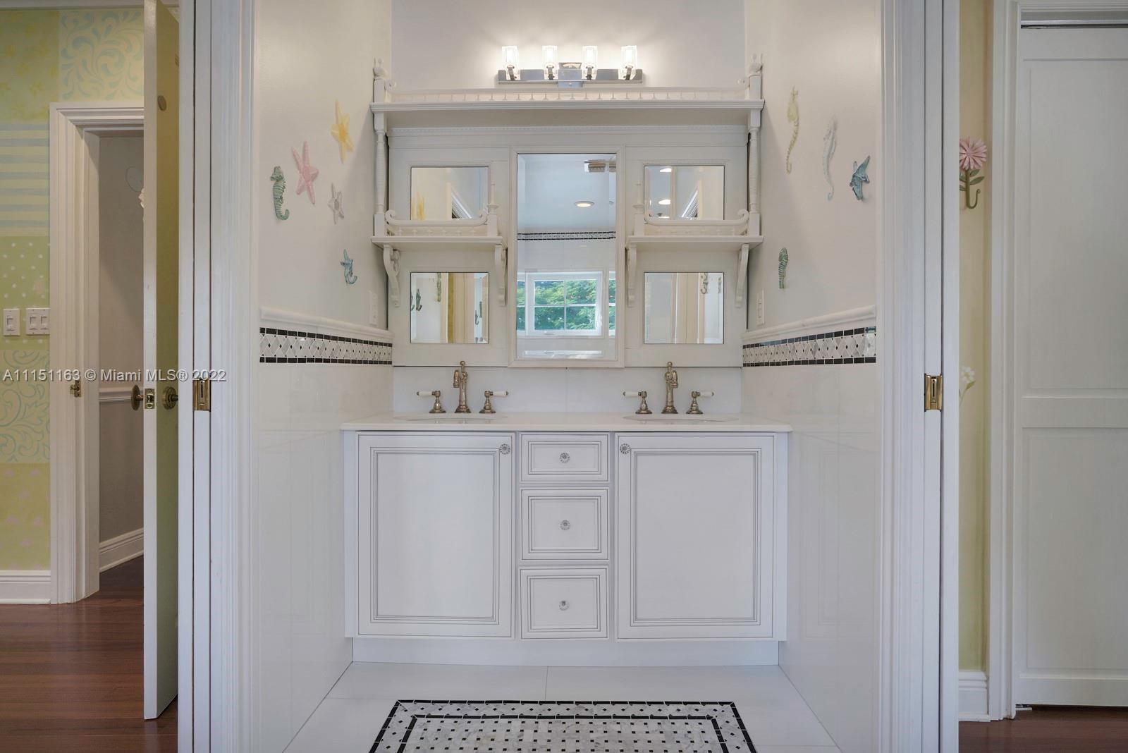 13920 Stirling Road Southwest Ranches, FL 33330 - Photo 66 of 98 a bathroom with a sink a toilet and a mirror