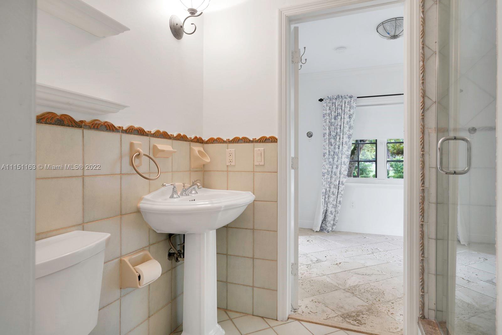 13920 Stirling Road Southwest Ranches, FL 33330 - Photo 87 of 98 a bathroom with a sink and shower