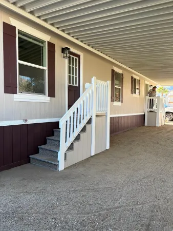 a view of house with deck and balcony