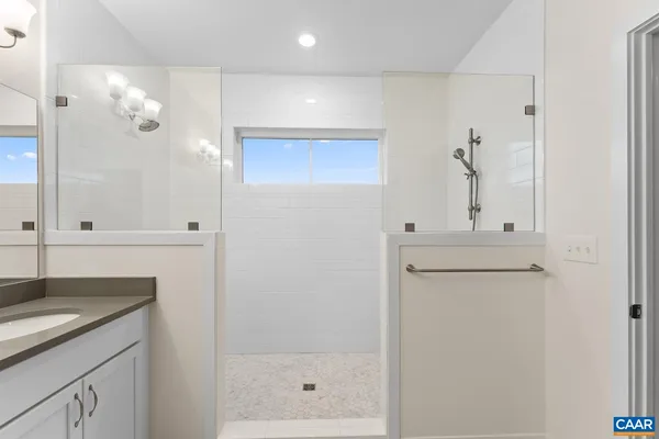 a bathroom with a sink a toilet and shower curtain