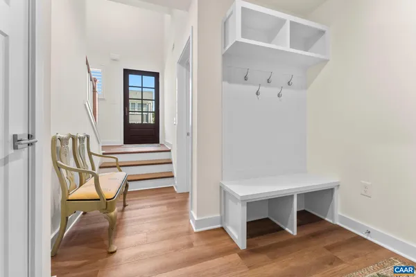 a front view of a house with a yard and a garage