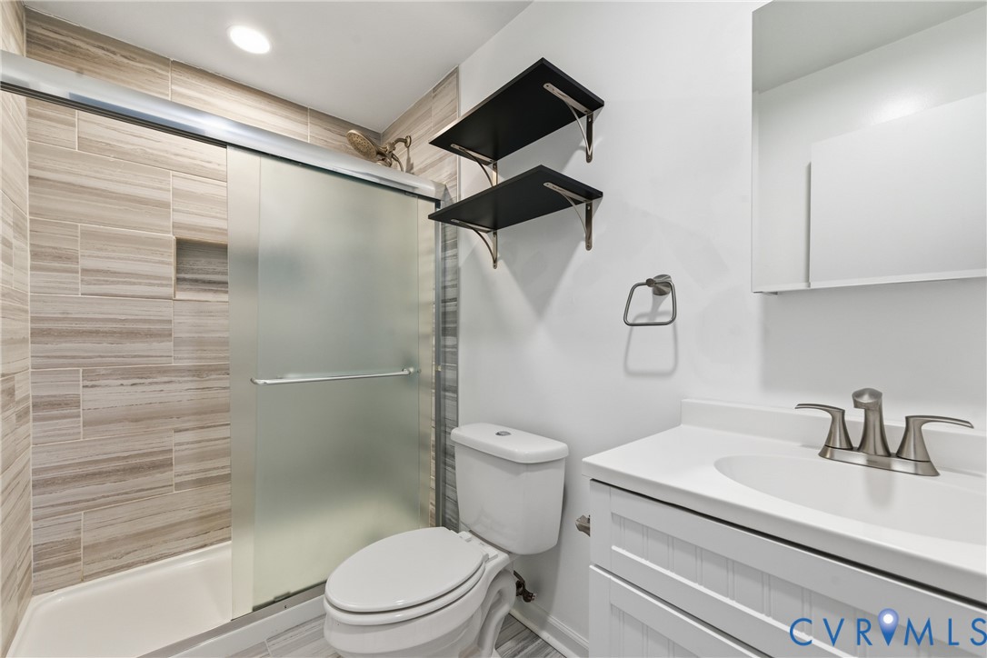 11008 Ryall Road Glen Allen, VA 23059 - Photo 15 of 25 a bathroom with a sink a toilet and shower