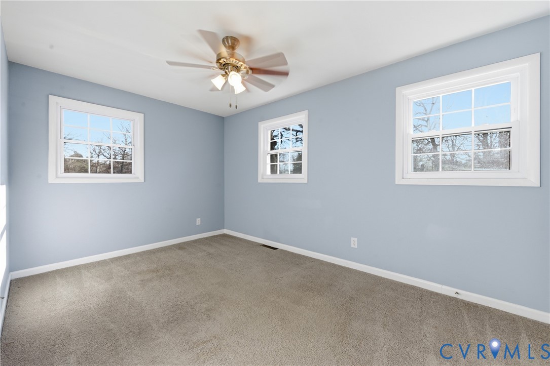 11008 Ryall Road Glen Allen, VA 23059 - Photo 16 of 25 a view of an empty room with a window