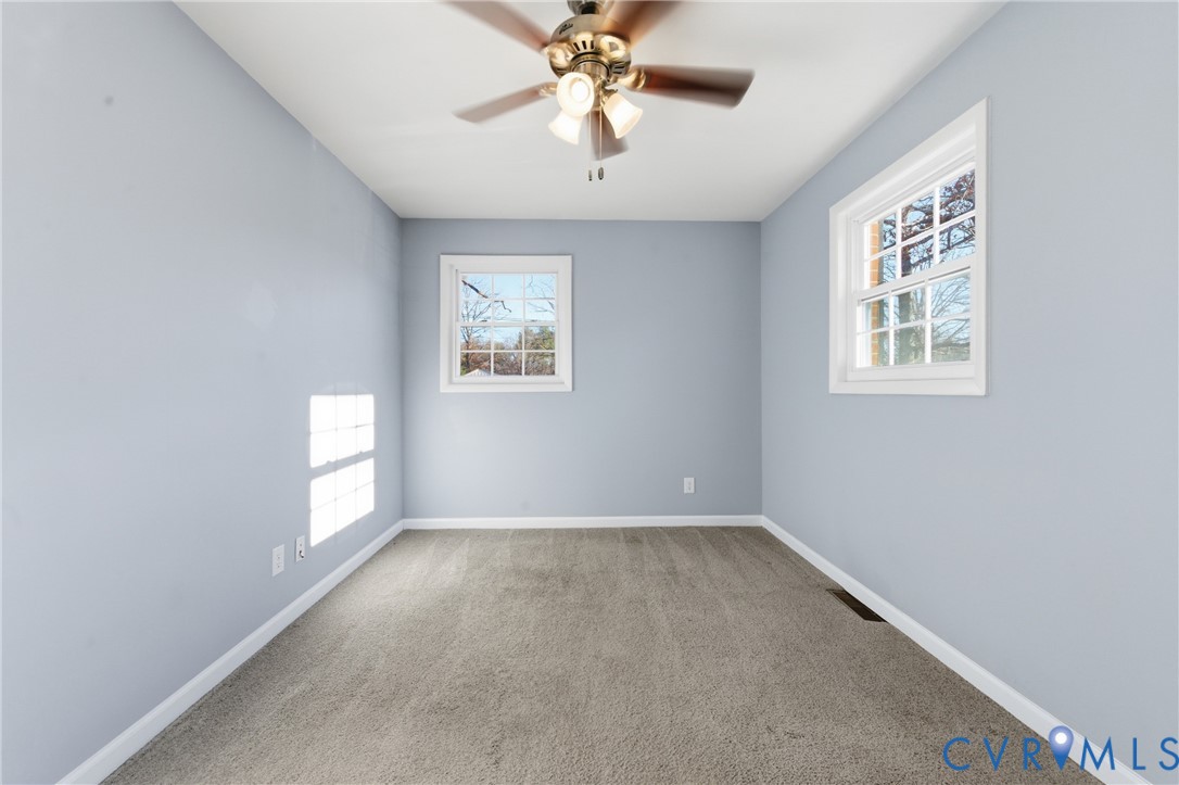 11008 Ryall Road Glen Allen, VA 23059 - Photo 17 of 25 wooden floor in an empty room with a window