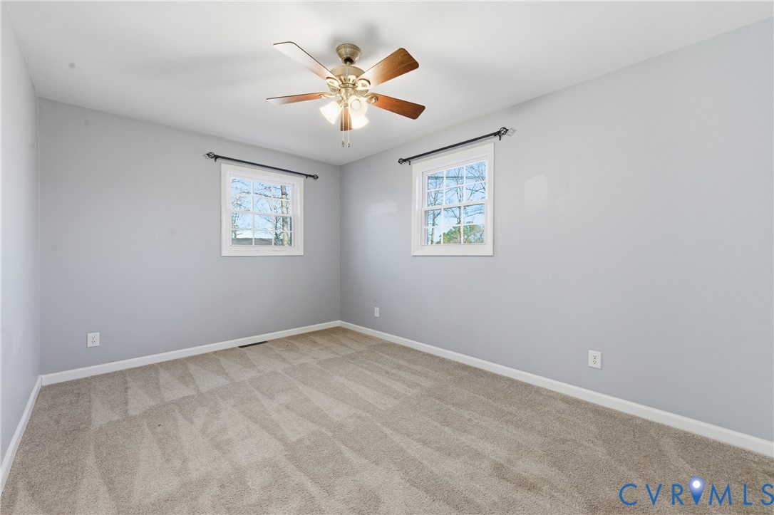 11008 Ryall Road Glen Allen, VA 23059 - Photo 19 of 25 an empty room with windows and fan