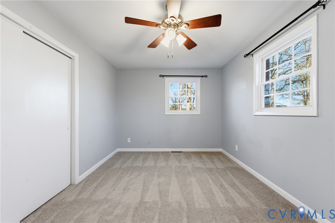 11008 Ryall Road Glen Allen, VA 23059 - Photo 20 of 25 wooden floor in an empty room with a window