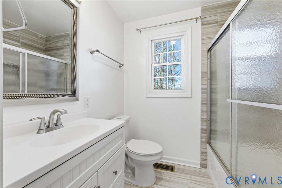 11008 Ryall Road Glen Allen, VA 23059 - Photo 21 of 25 a bathroom with a sink a toilet and shower